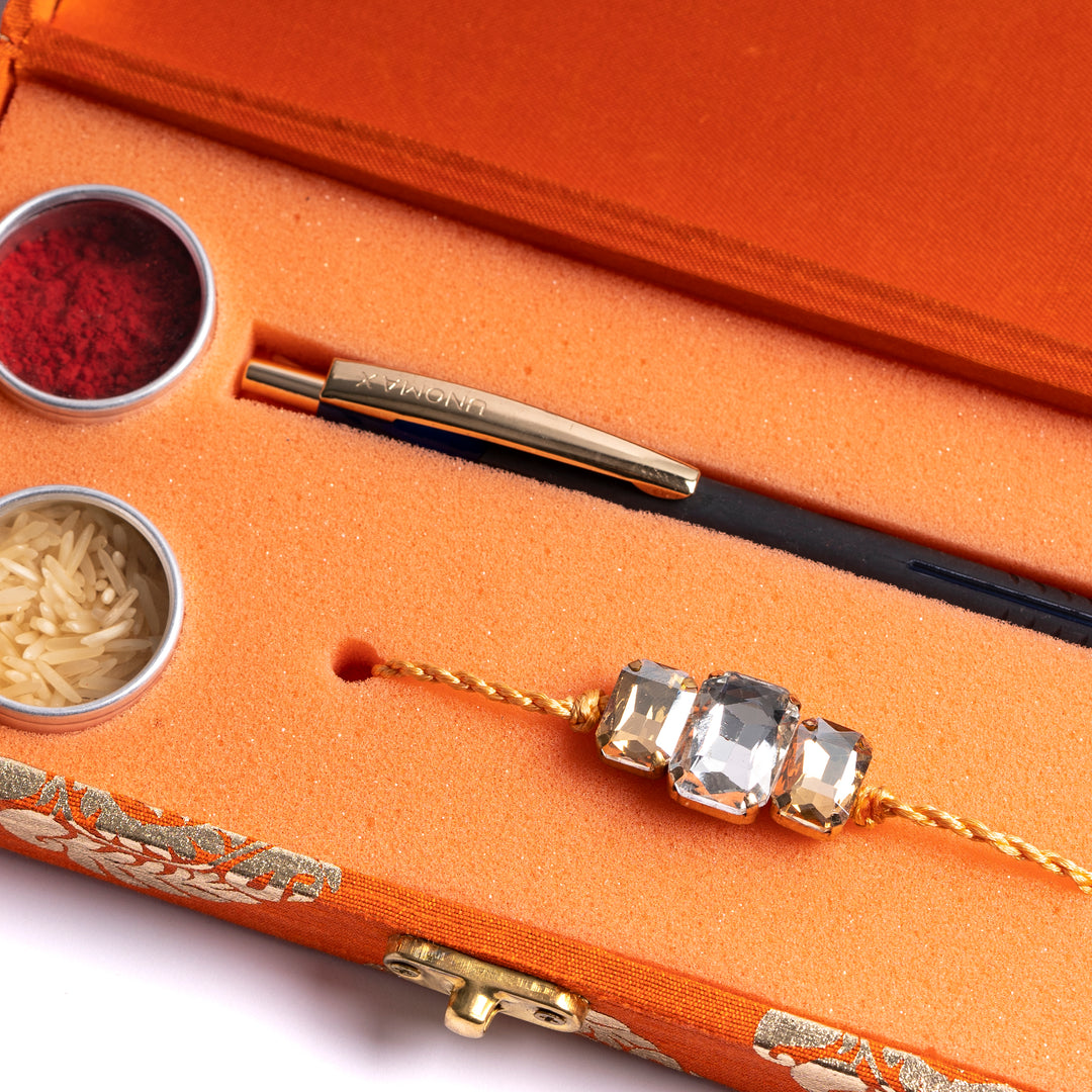 Orange Rakhi with Pen Gift Set